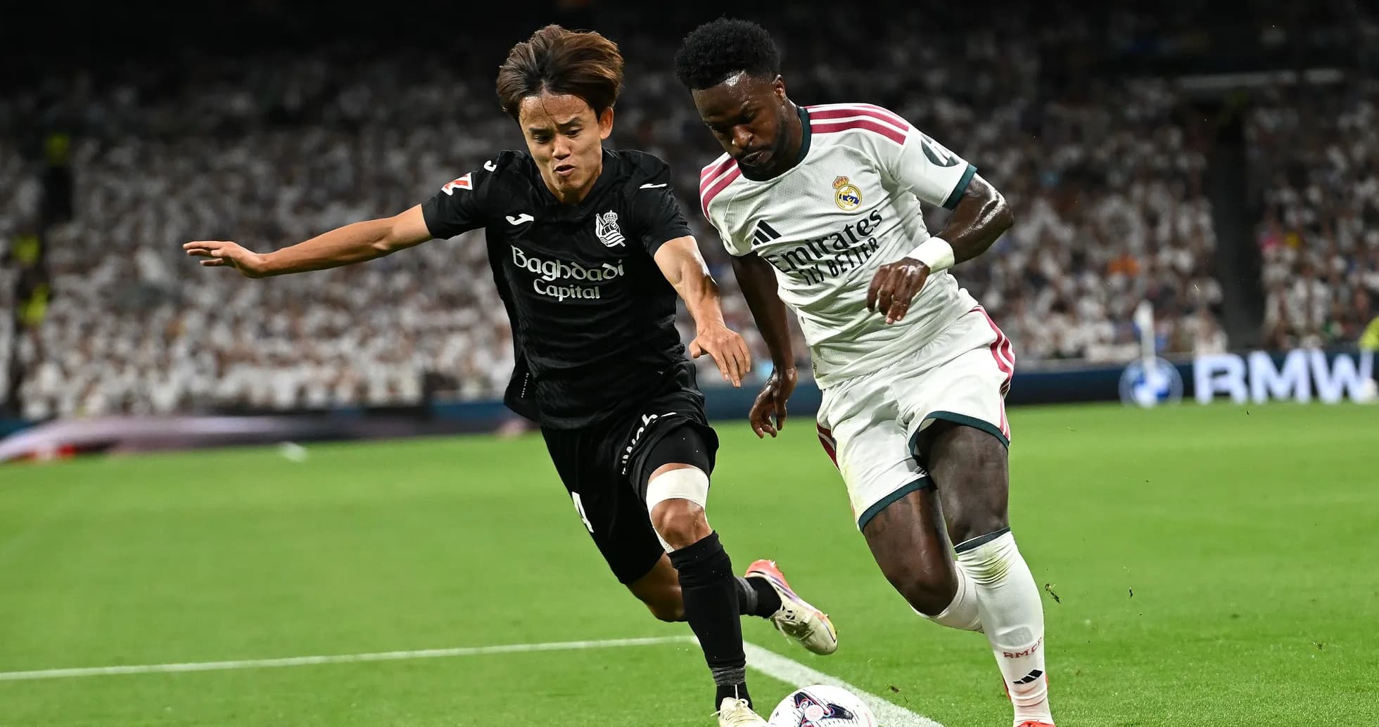 Two players competing for the ball on field