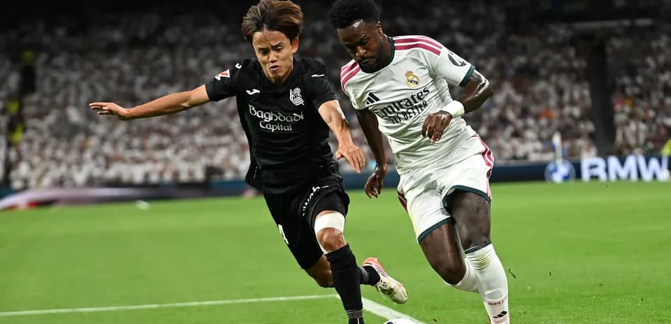 Two players competing for the ball on field