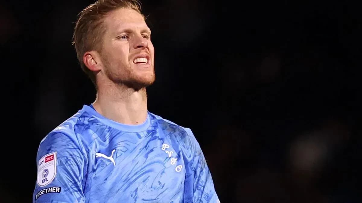 Goalkeeper wearing blue kit during match