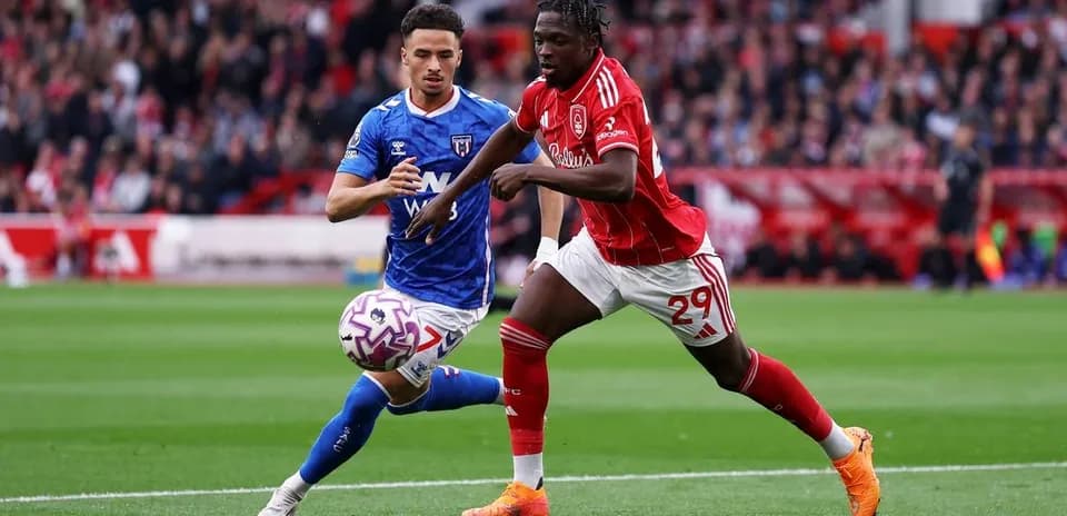 Players competing for the ball during match