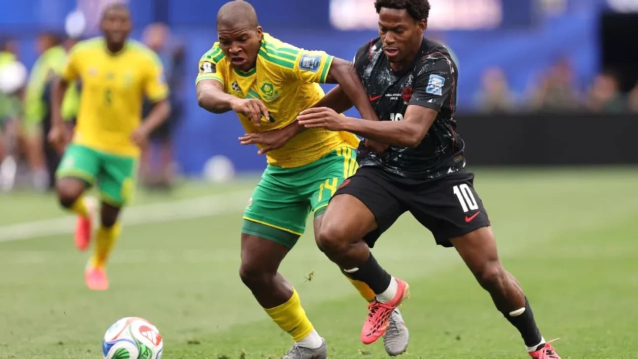 Players battling for possession during soccer match