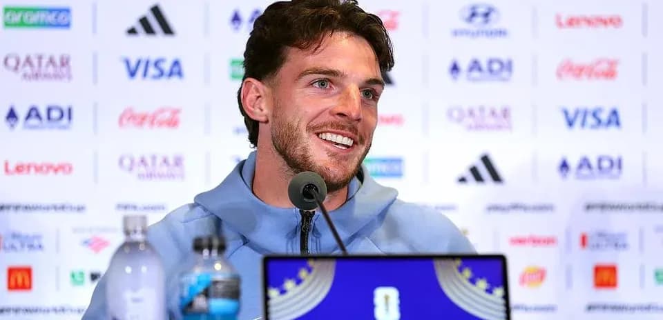 Player speaking at press conference with sponsors backdrop