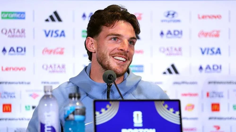 Player speaking at press conference with sponsors backdrop