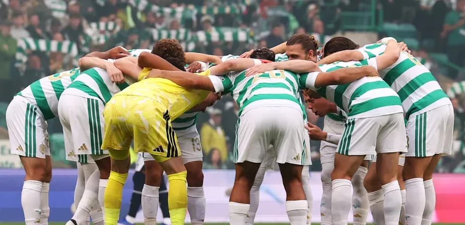 Celtic players in a huddle before the match