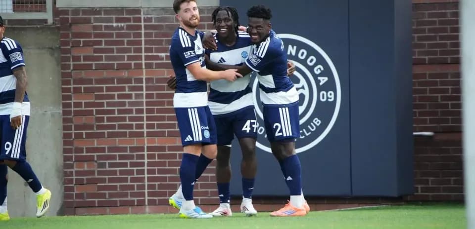 Players celebrating a goal during match