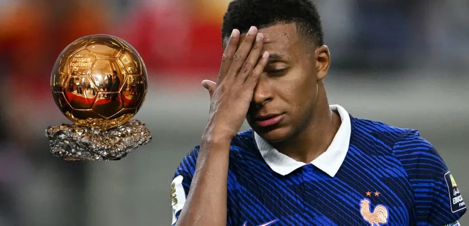 Player looking distressed near Ballon d'Or trophy