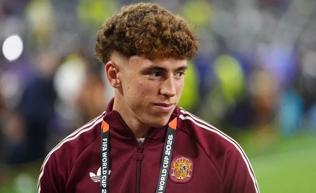 Player in maroon jacket at FIFA World Cup event