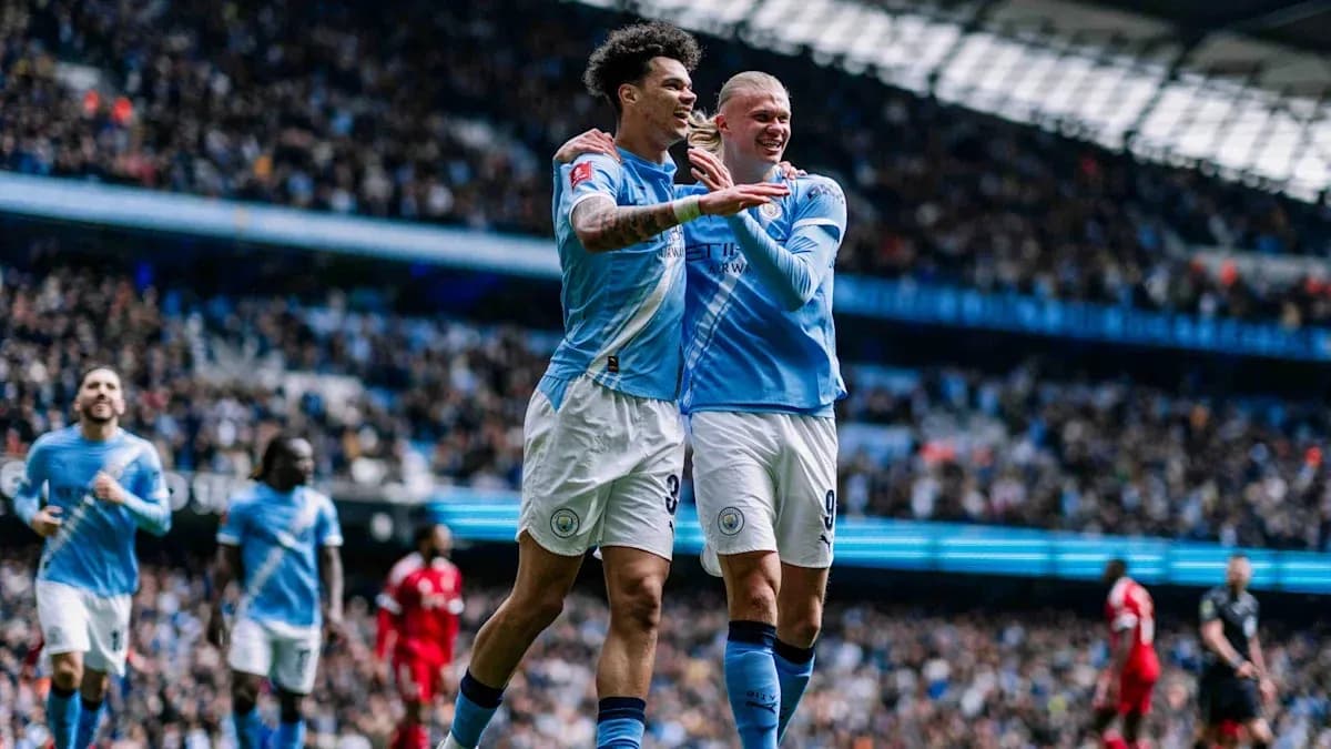 Manchester City players celebrating a goal on field