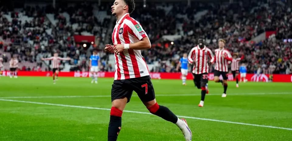 Player celebrating a goal on the pitch