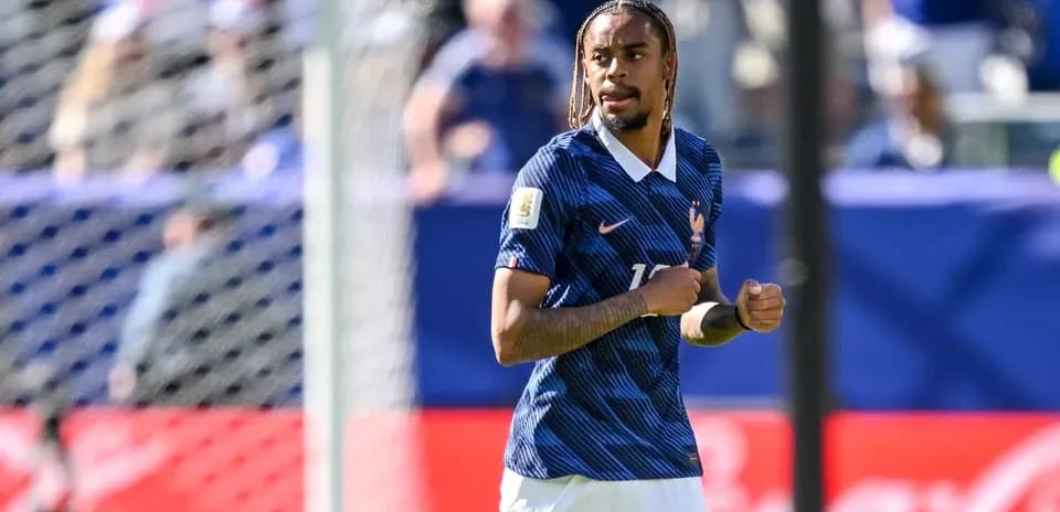Player in France kit during match action