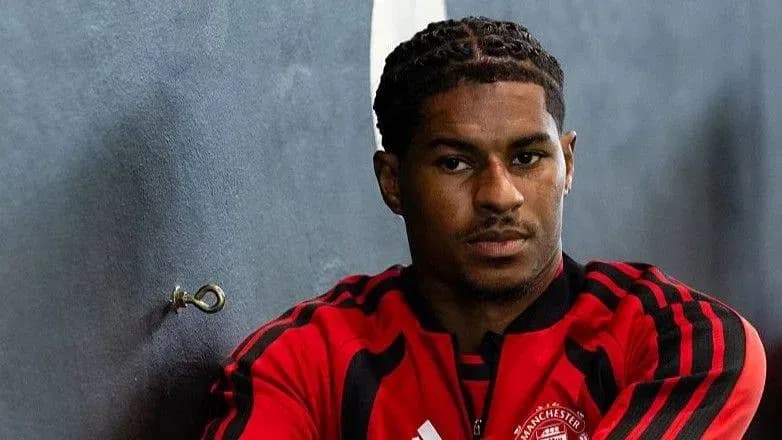 Player sitting against wall in training gear