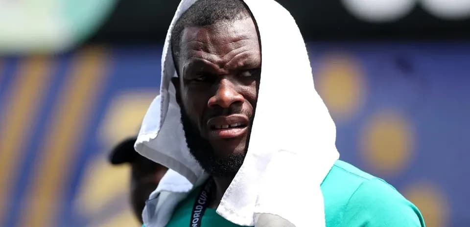 Player wearing a towel on head during training