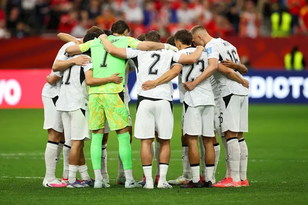 Team huddled together before the match kickoff