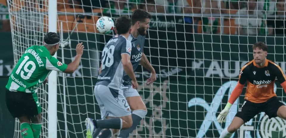 Goalkeeper preparing for a shot during match