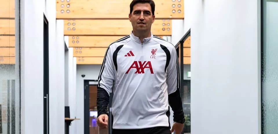 Football coach walking in training facility corridor