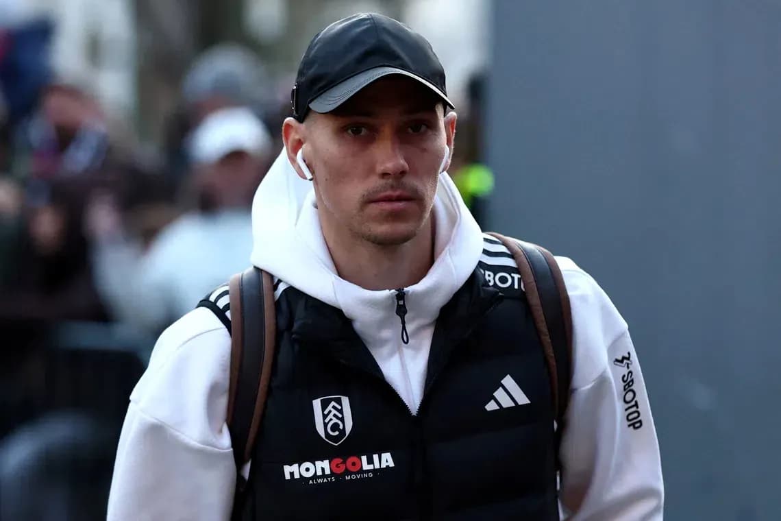 Player arriving at stadium wearing team apparel