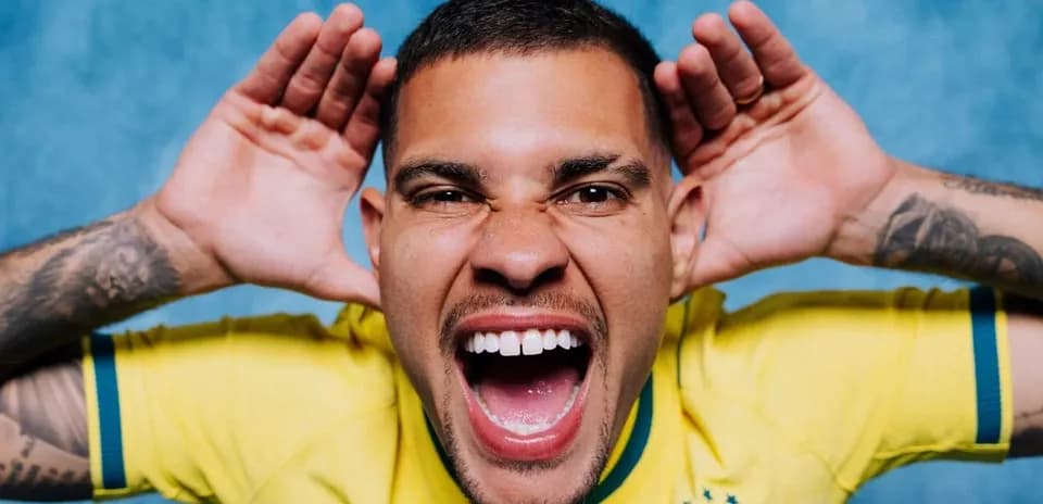 Player in Brazil jersey making a playful gesture