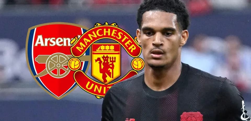 Player in black kit with Arsenal and Manchester United logos