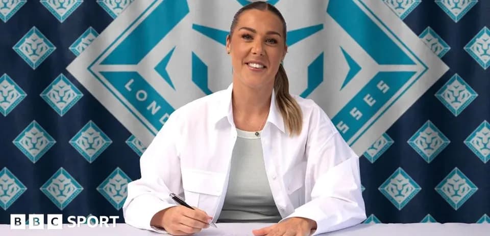 Player signing contract at promotional event