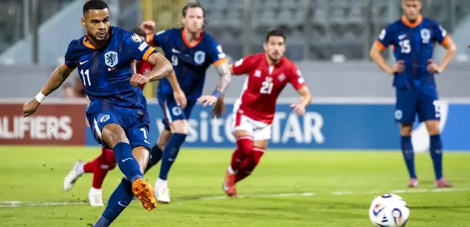 Player taking a penalty kick during match