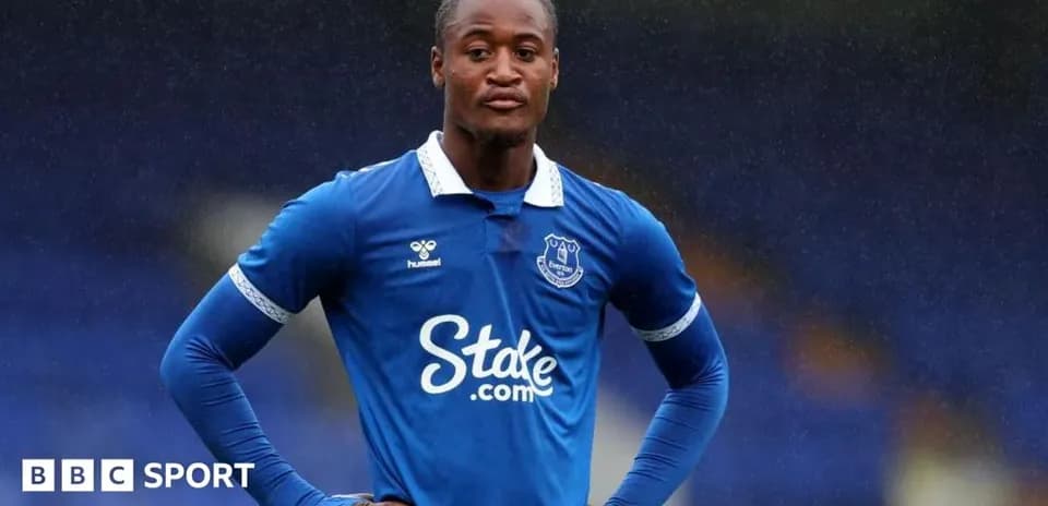 Player wearing Everton kit standing on the pitch