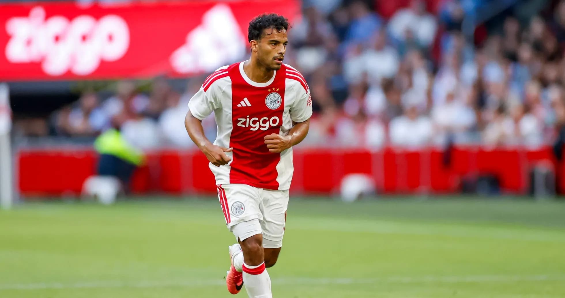 Player running with ball during Ajax match