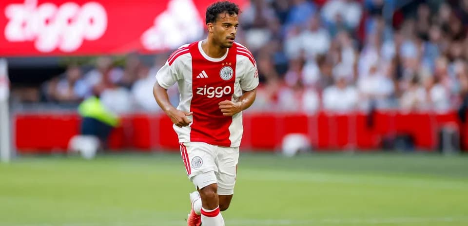 Player running with ball during Ajax match