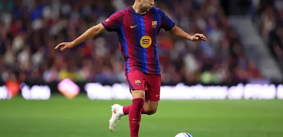 Barcelona player dribbling ball on field