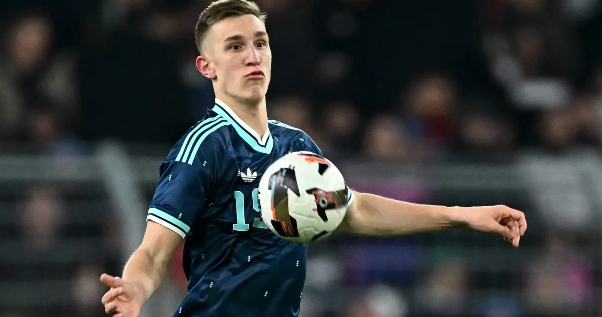 Player throwing ball during a football match