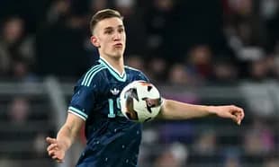 Player throwing ball during a football match