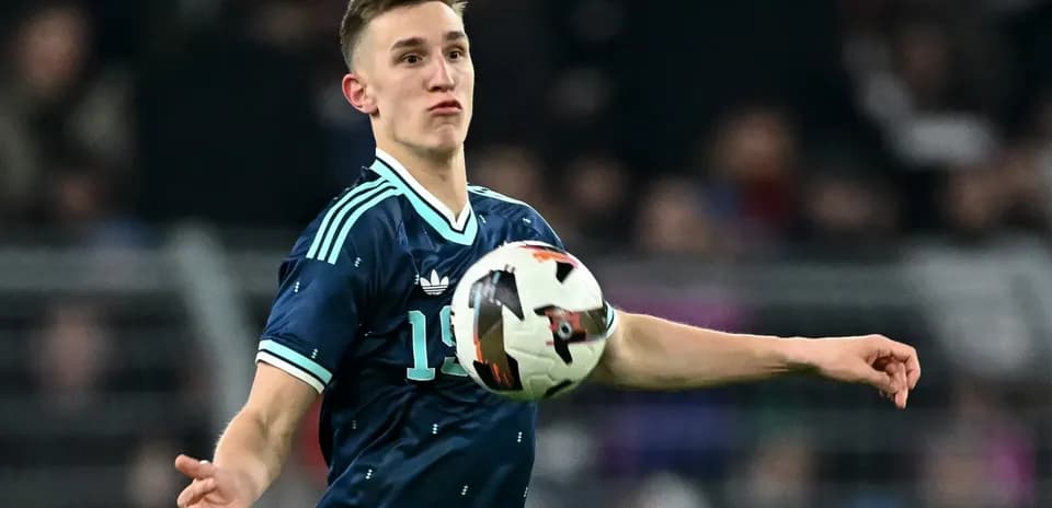 Player throwing ball during a football match