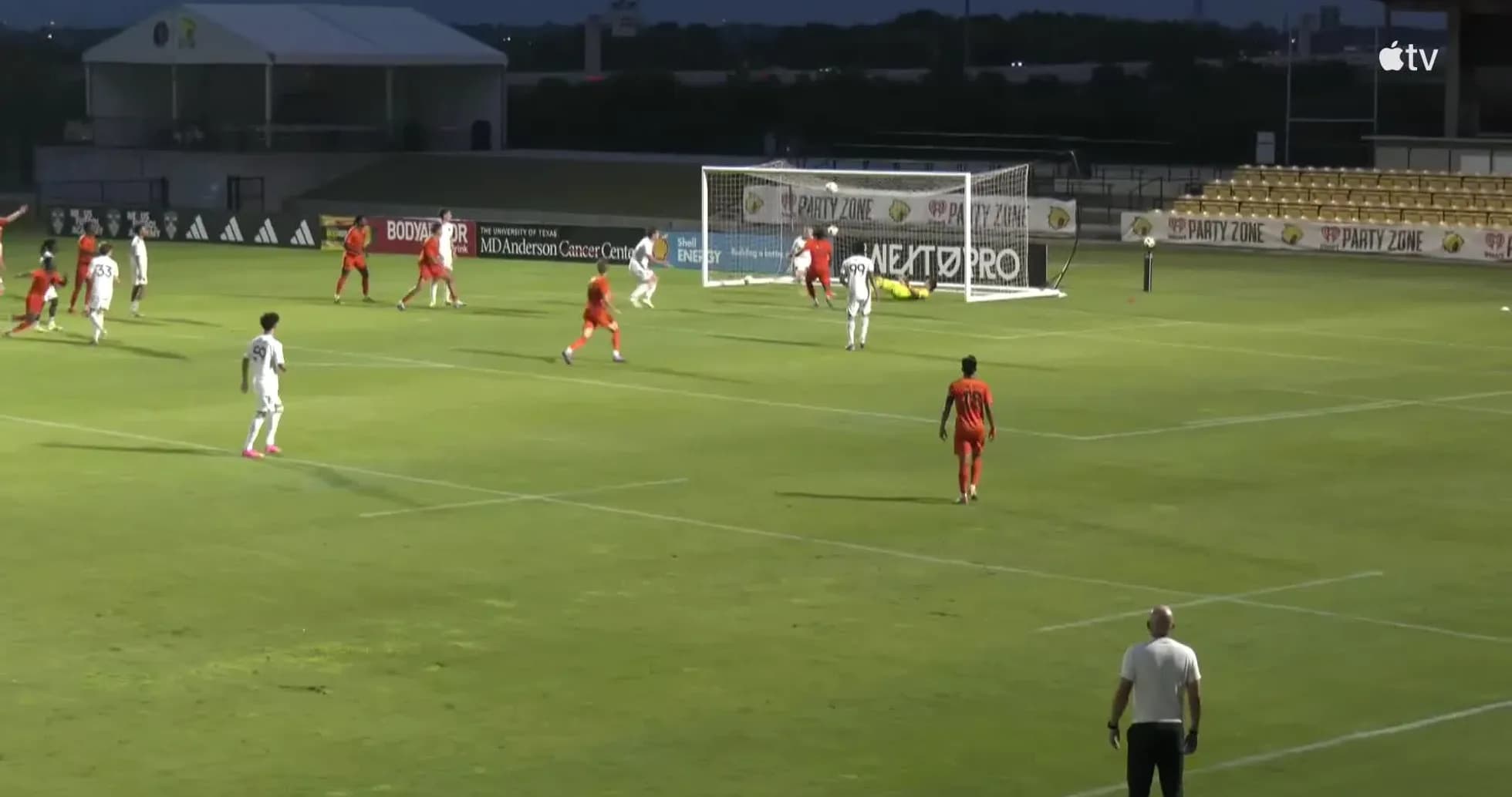 Players contesting for the ball near the goal