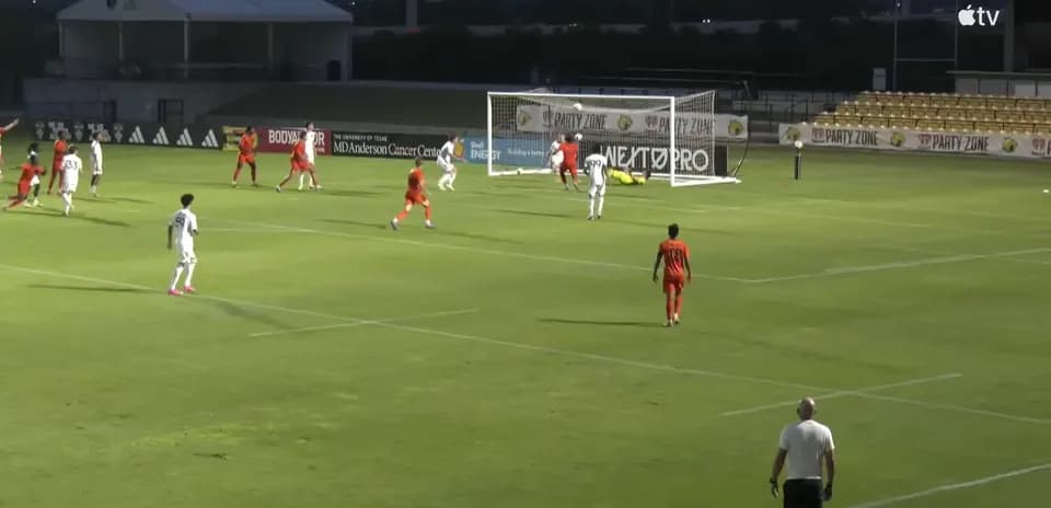Players contesting for the ball near the goal