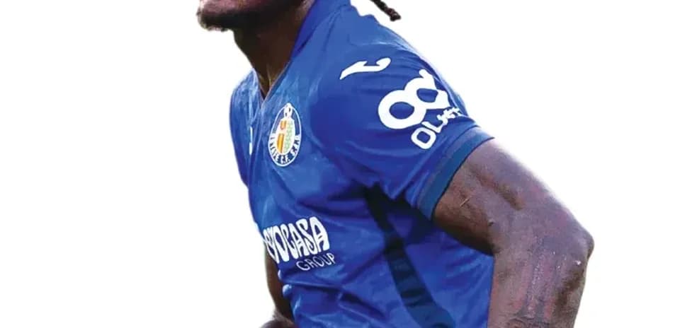 Player in blue jersey celebrating on the field