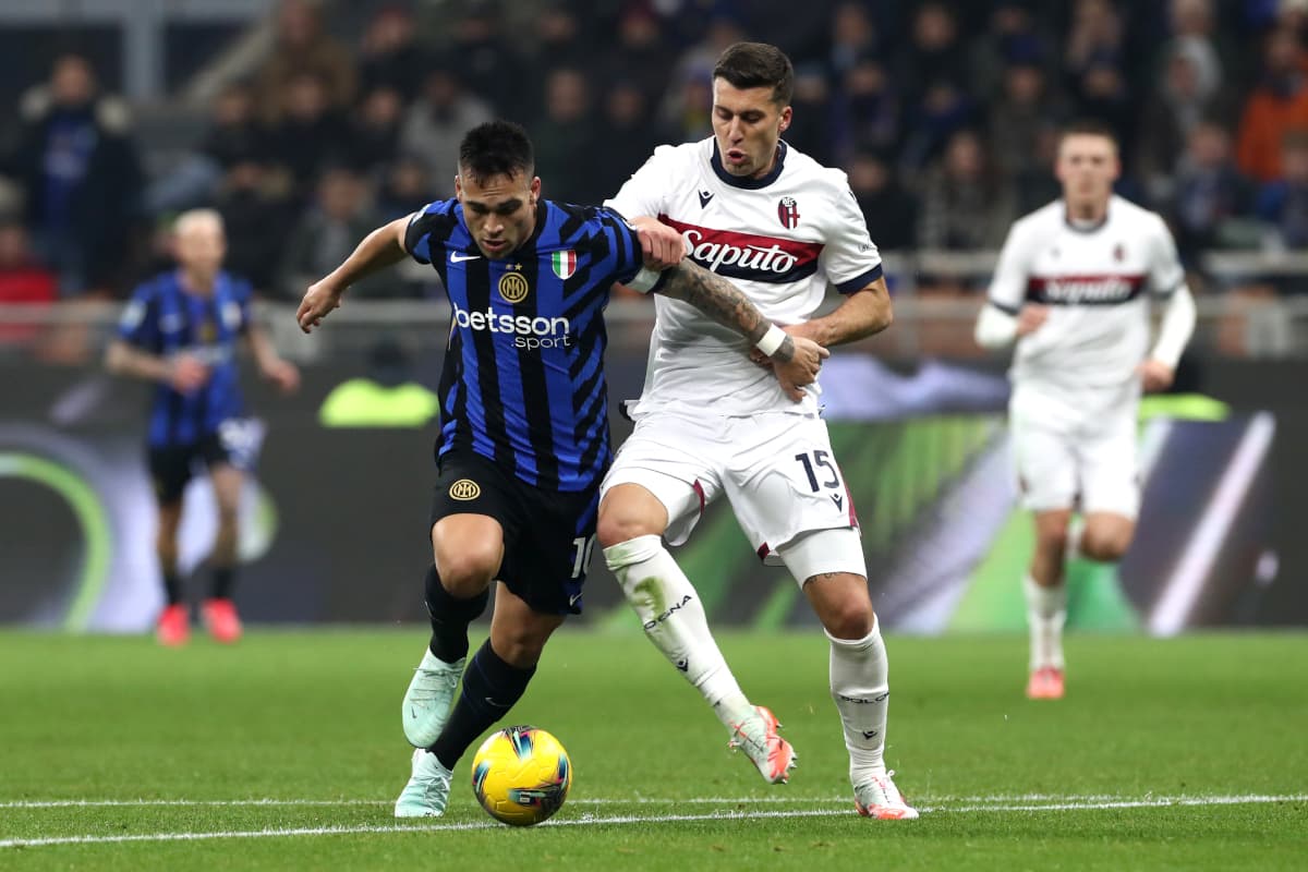 Lautaro Martínez challenged by Bologna defender