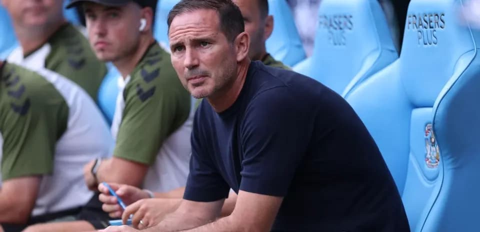 Coach sitting on bench during match observation