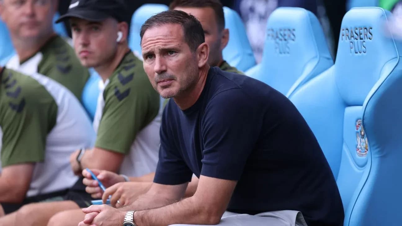 Coach sitting on bench during match observation