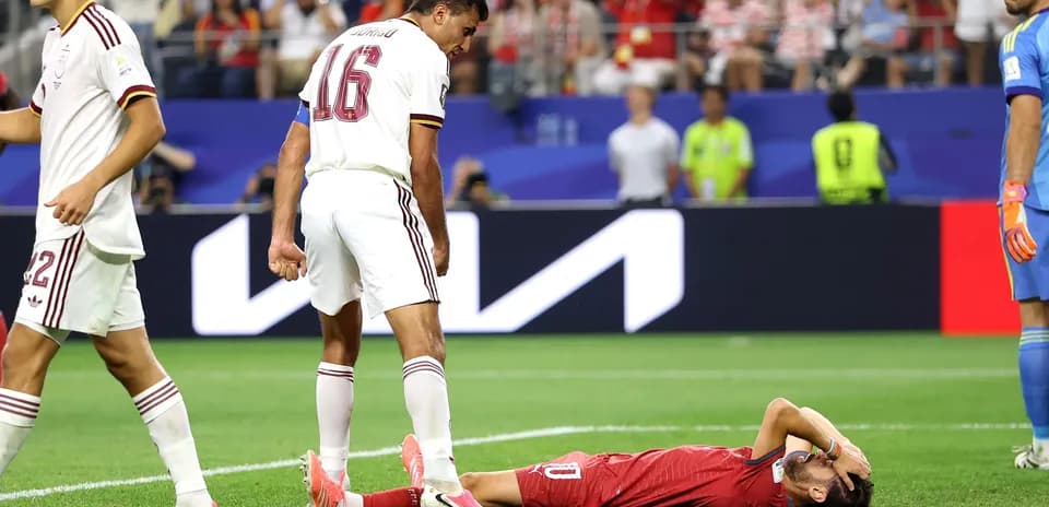 Player lying on ground after collision during match