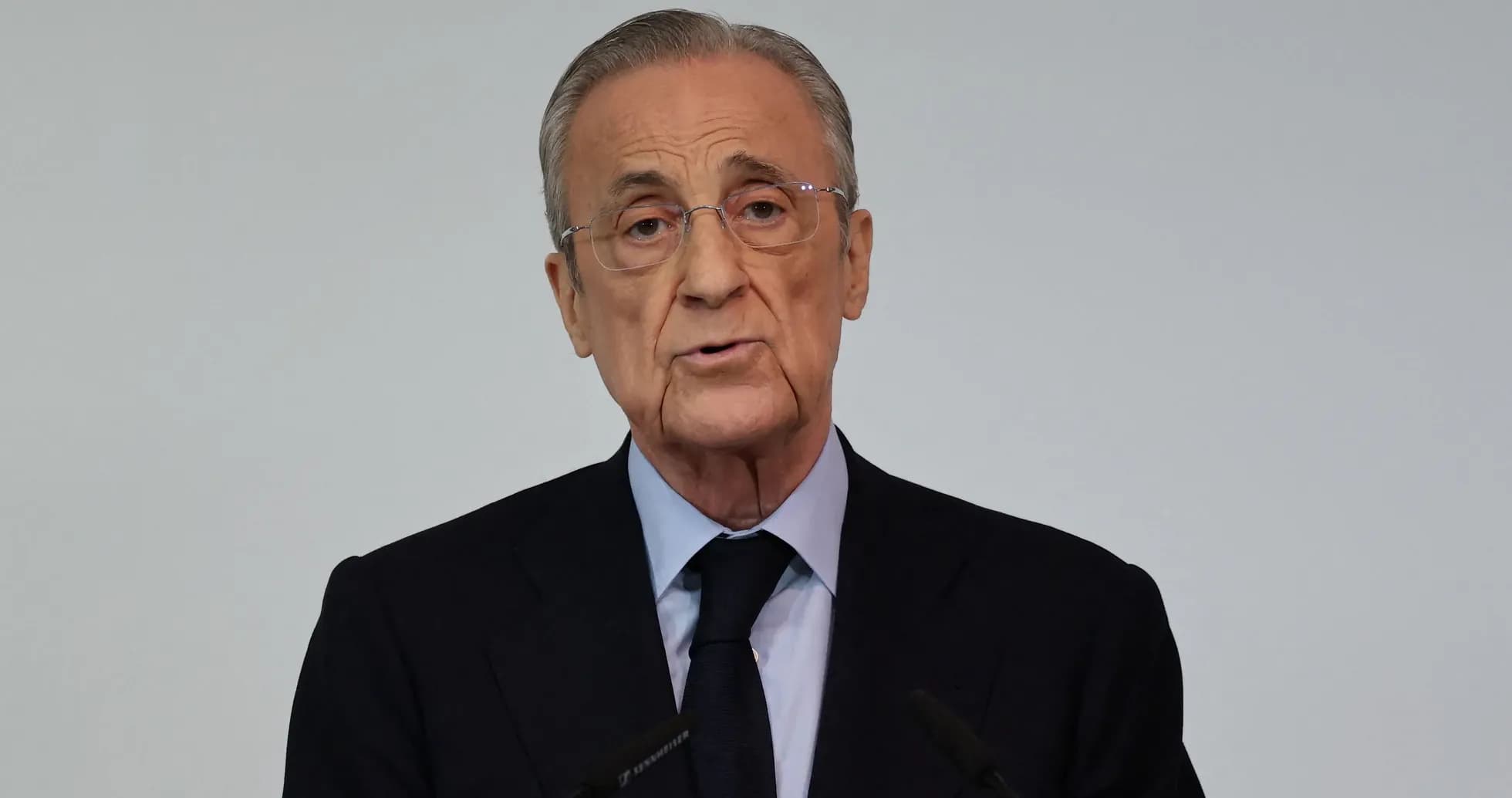 Man speaking at a podium during press conference