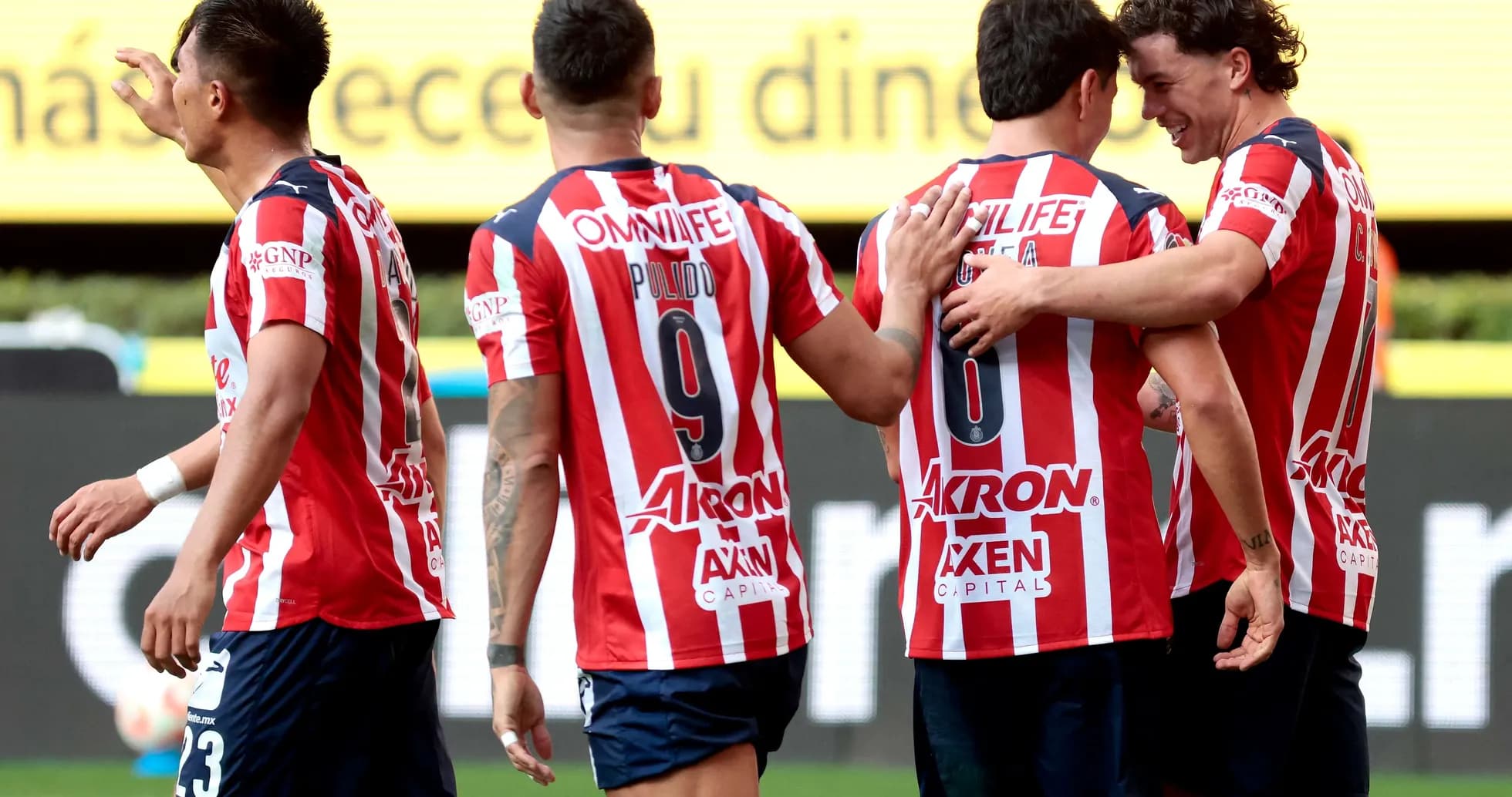 Chivas players celebrating a goal during match
