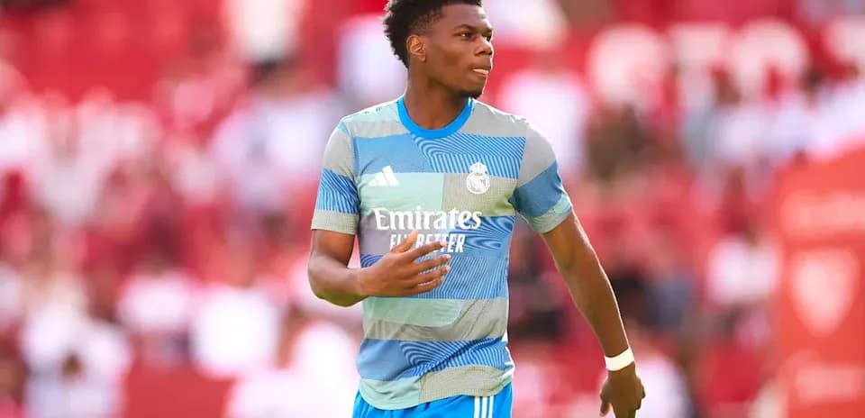 Player in Real Madrid training kit on the pitch