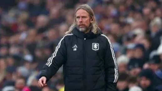 Manager in black jacket directing the team