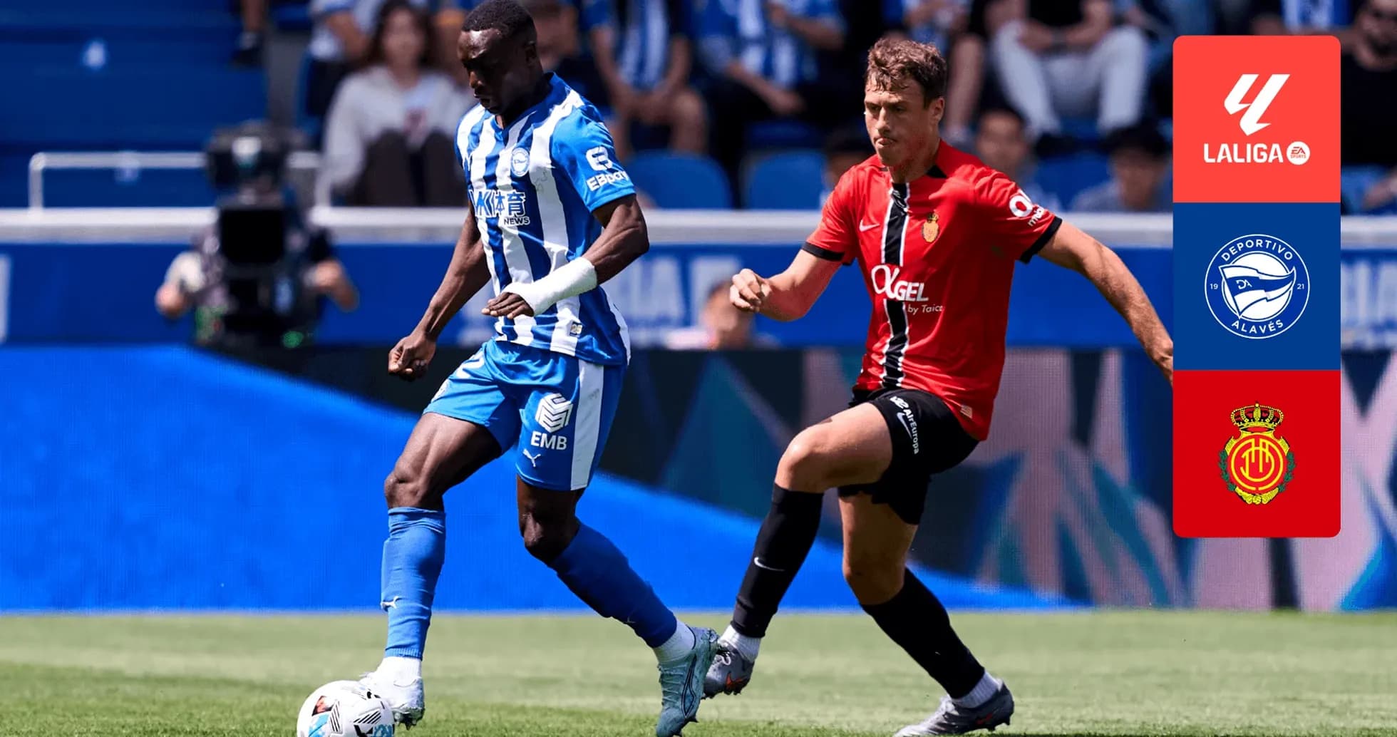 Deportivo Alaves player dribbling past Mallorca opponent