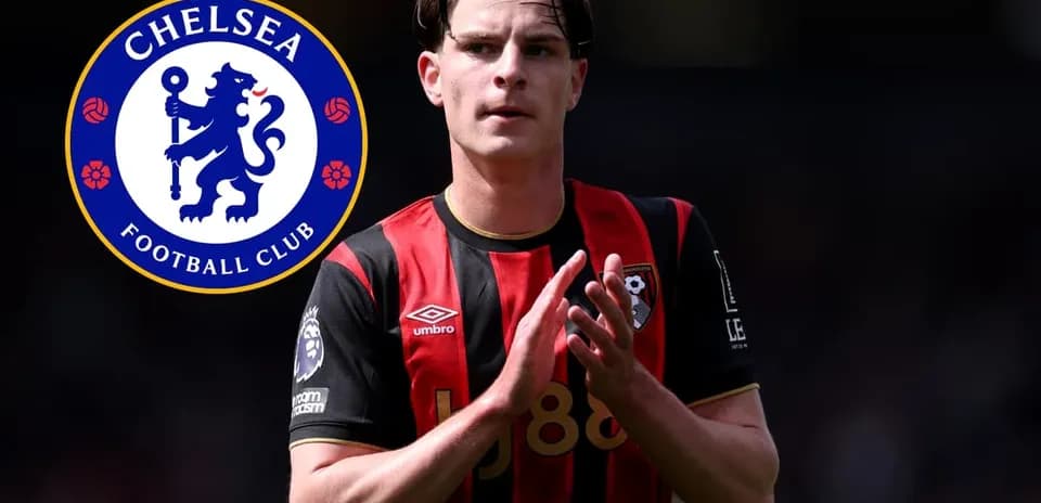 Player in Bournemouth kit applauding with Chelsea logo
