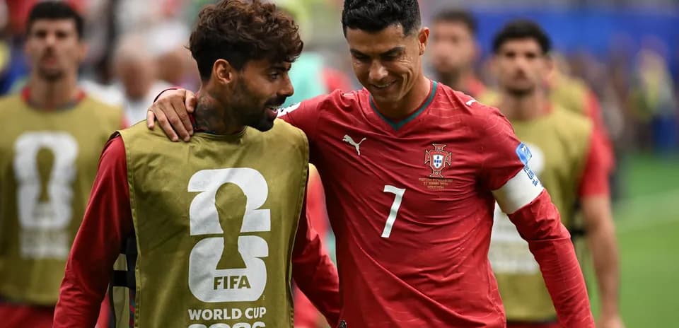Cristiano Ronaldo and teammate walking on field