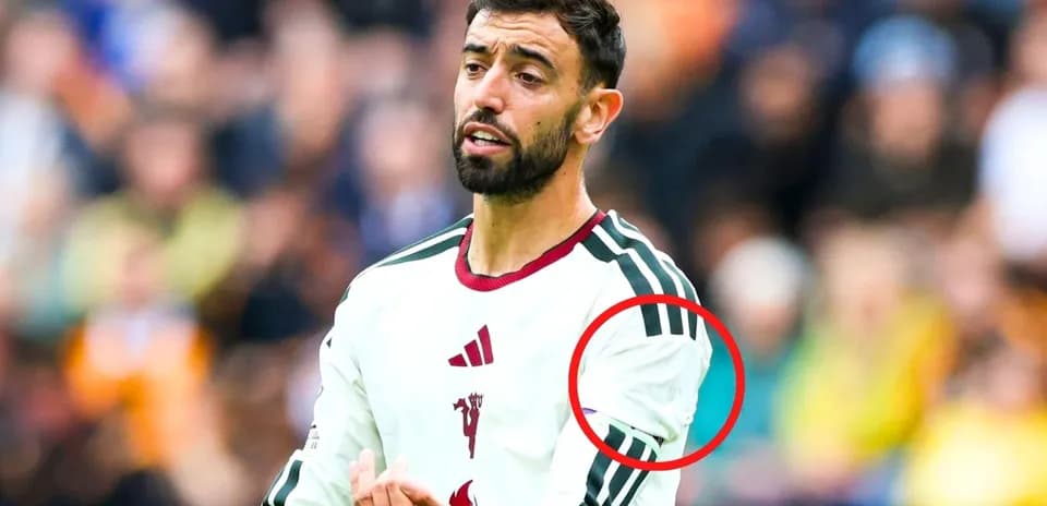 Player gesturing during match, wearing team jersey