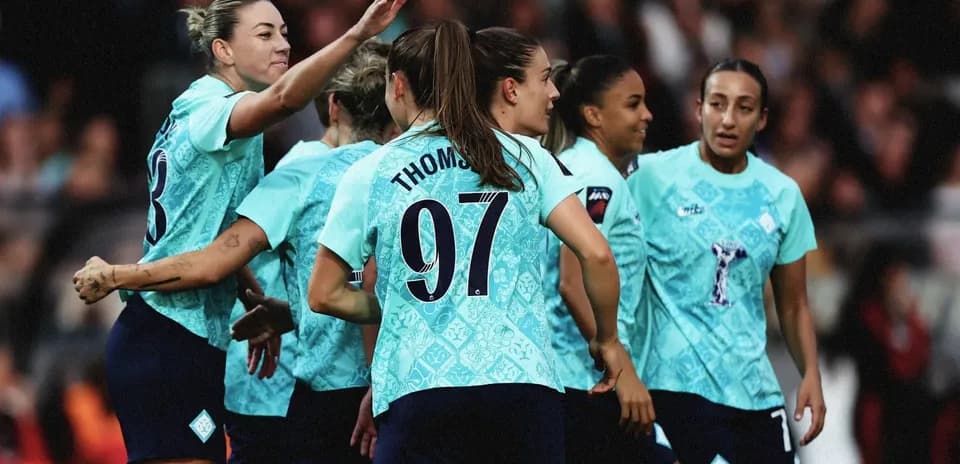 Players celebrating a goal during a match