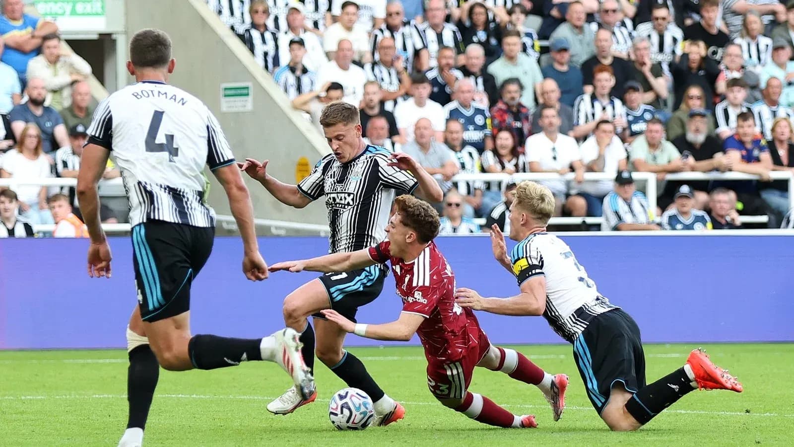 Players contesting the ball during a match action