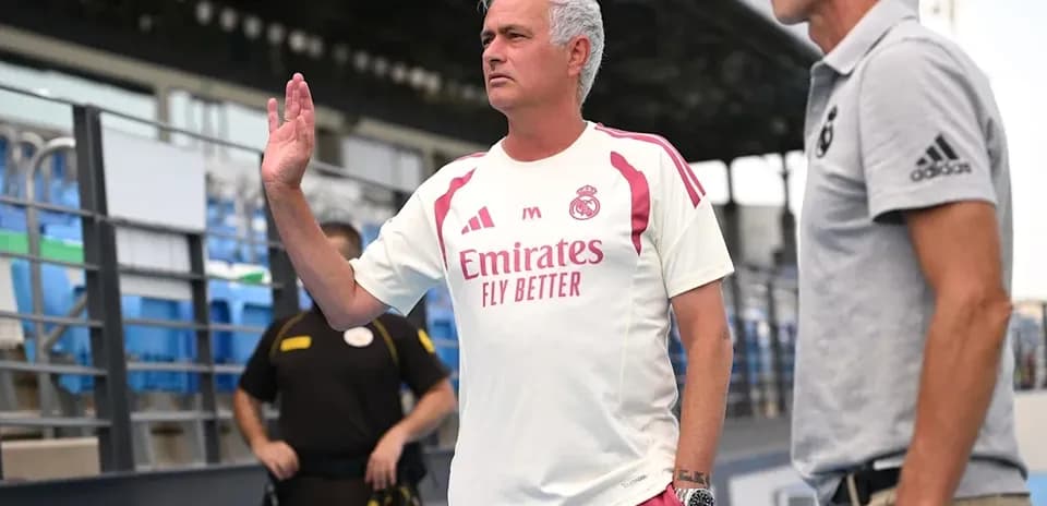 Manager gesturing during training session at stadium