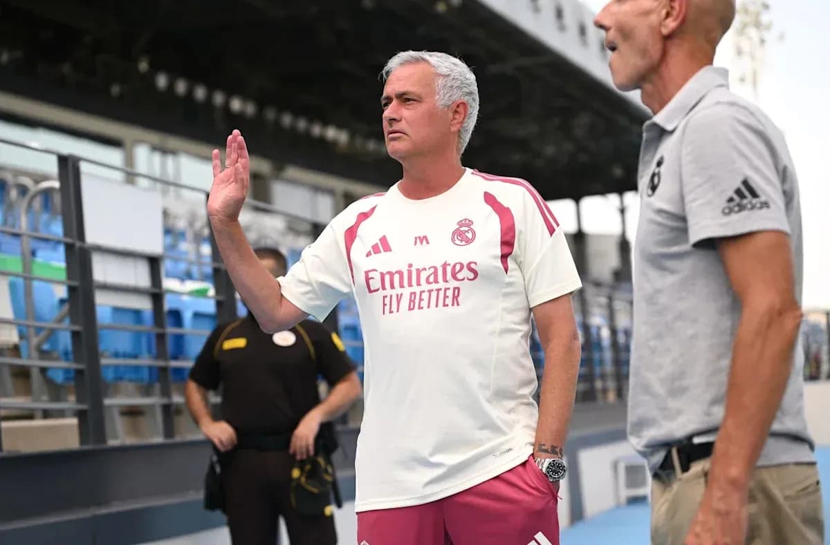Manager gesturing during training session at stadium